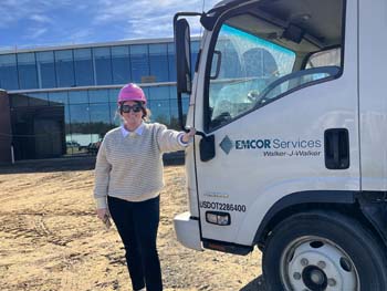 Walker J Walker employee wearing a pink hard hat